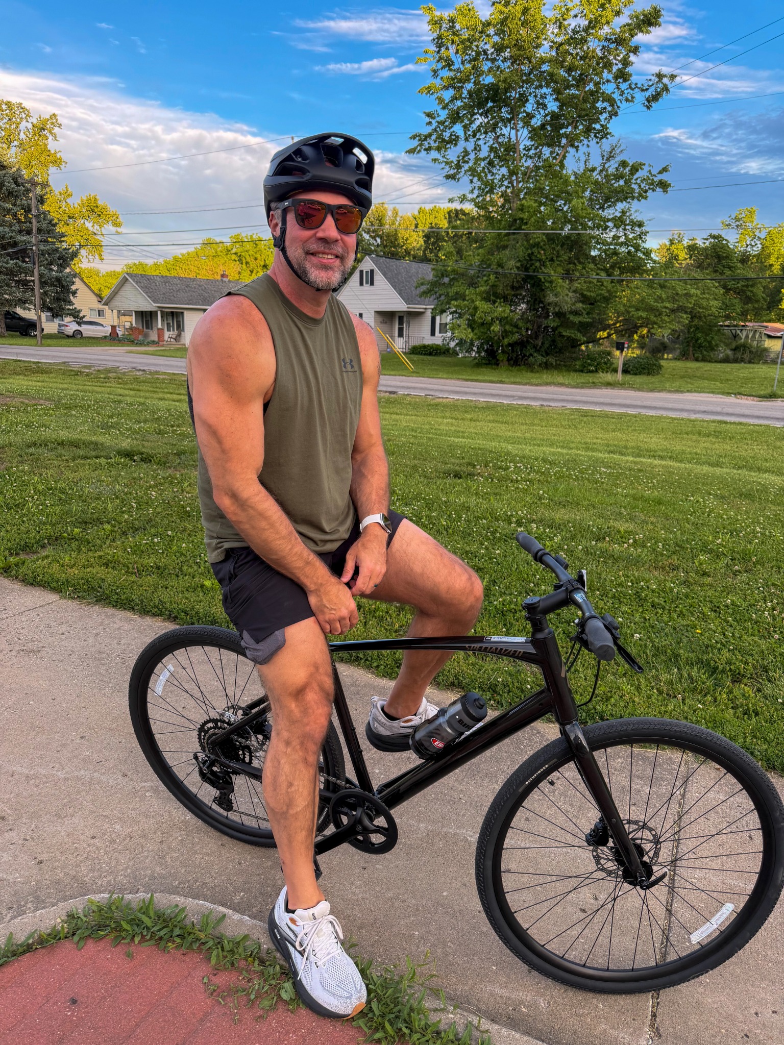 David (Nate) Campbell wearing a helmet and seated on his bicycle outdoors